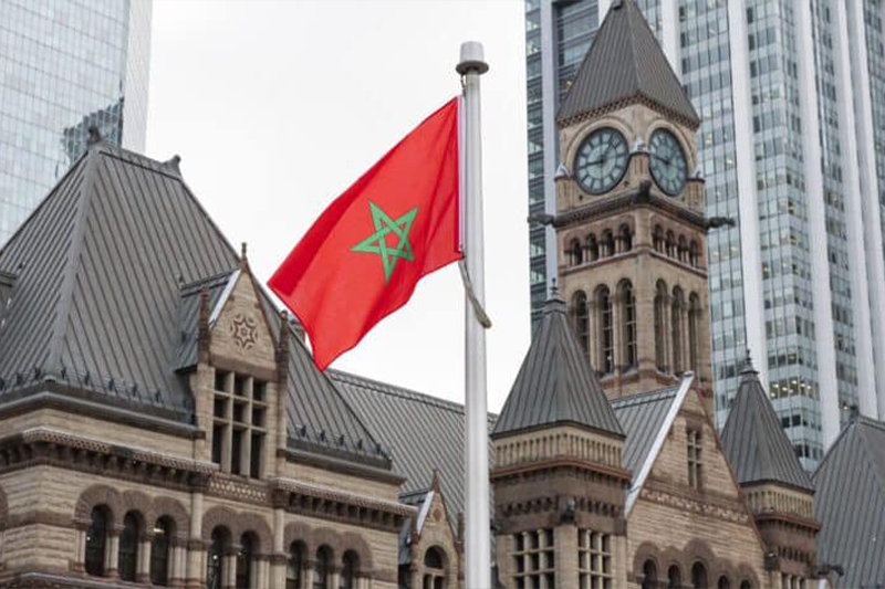  العلم المغربي يزين مبنيي برلمان أونتاريو وبلدية تورونتو بكندا